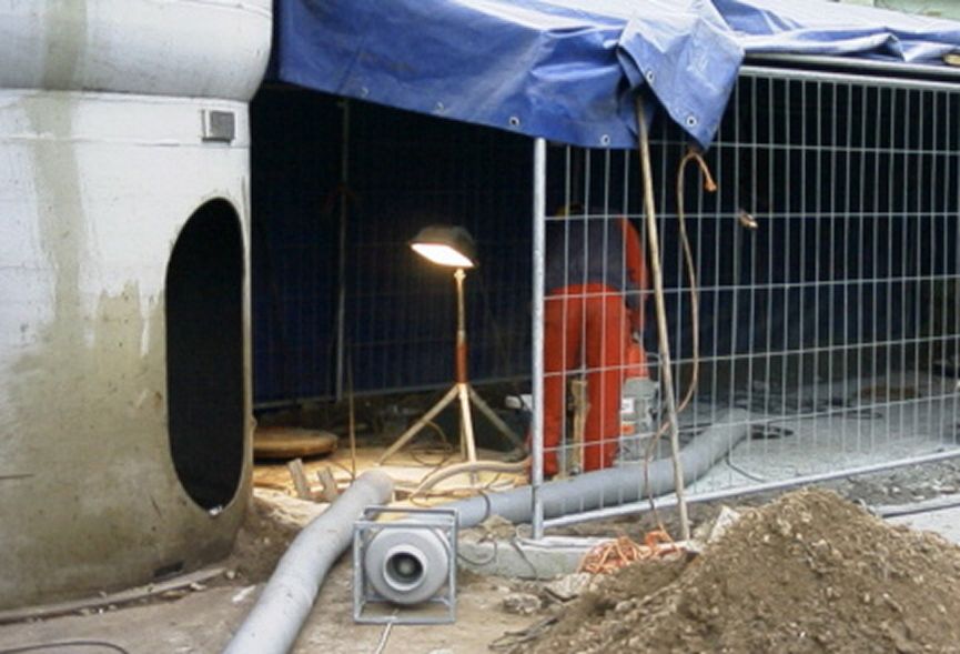 A separator system on a building shell with an employee in work clothes