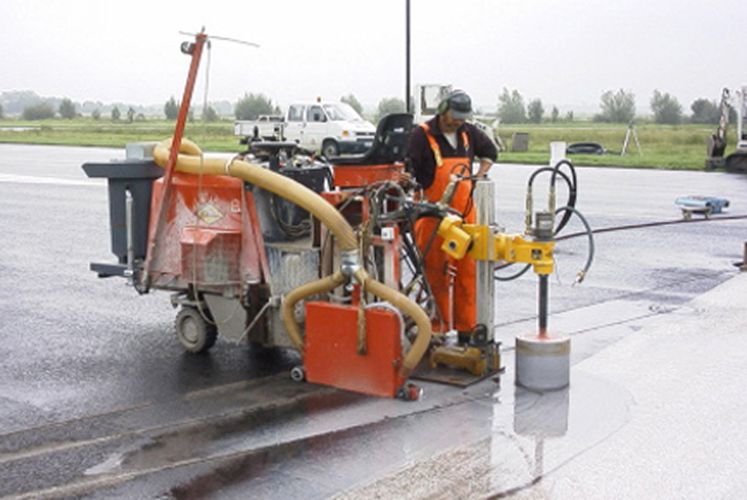 Drilling for underfloor lighting on a runway at an airport